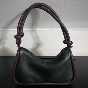 Black shoulder bag with brown piping